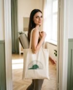 Elena, the stretching.shop AI guide, with the Boho Sun Tote Bag