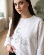 Elena, the stretching.shop AI guide, with the Downward Dog Sweatshirt