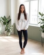 Elena, the stretching.shop AI guide, with the Downward Dog Sweatshirt