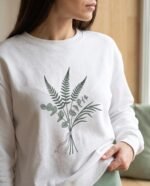 Elena, the stretching.shop AI guide, with the Grounding Sweatshirt