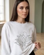 Elena, the stretching.shop AI guide, with the Lotus Line Sweatshirt