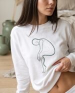 Elena, the stretching.shop AI guide, with the One Line Stretch Sweatshirt