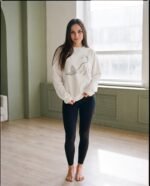 Elena, the stretching.shop AI guide, with the Stretching Cat Sweatshirt