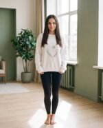 Elena, the stretching.shop AI guide, with the Sun & Moon Sweatshirt