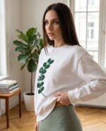 Elena, the stretching.shop AI guide, with the Eucalyptus Sprig Sweatshirt