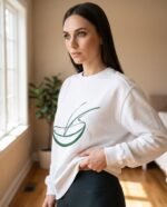 Elena, the stretching.shop AI guide, with the Half Moon Rest Sweatshirt