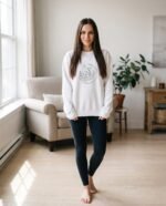 Elena, the stretching.shop AI guide, with the Moon Garden Sweatshirt
