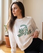 Elena, the stretching.shop AI guide, with the Stretching Cat Sweatshirt
